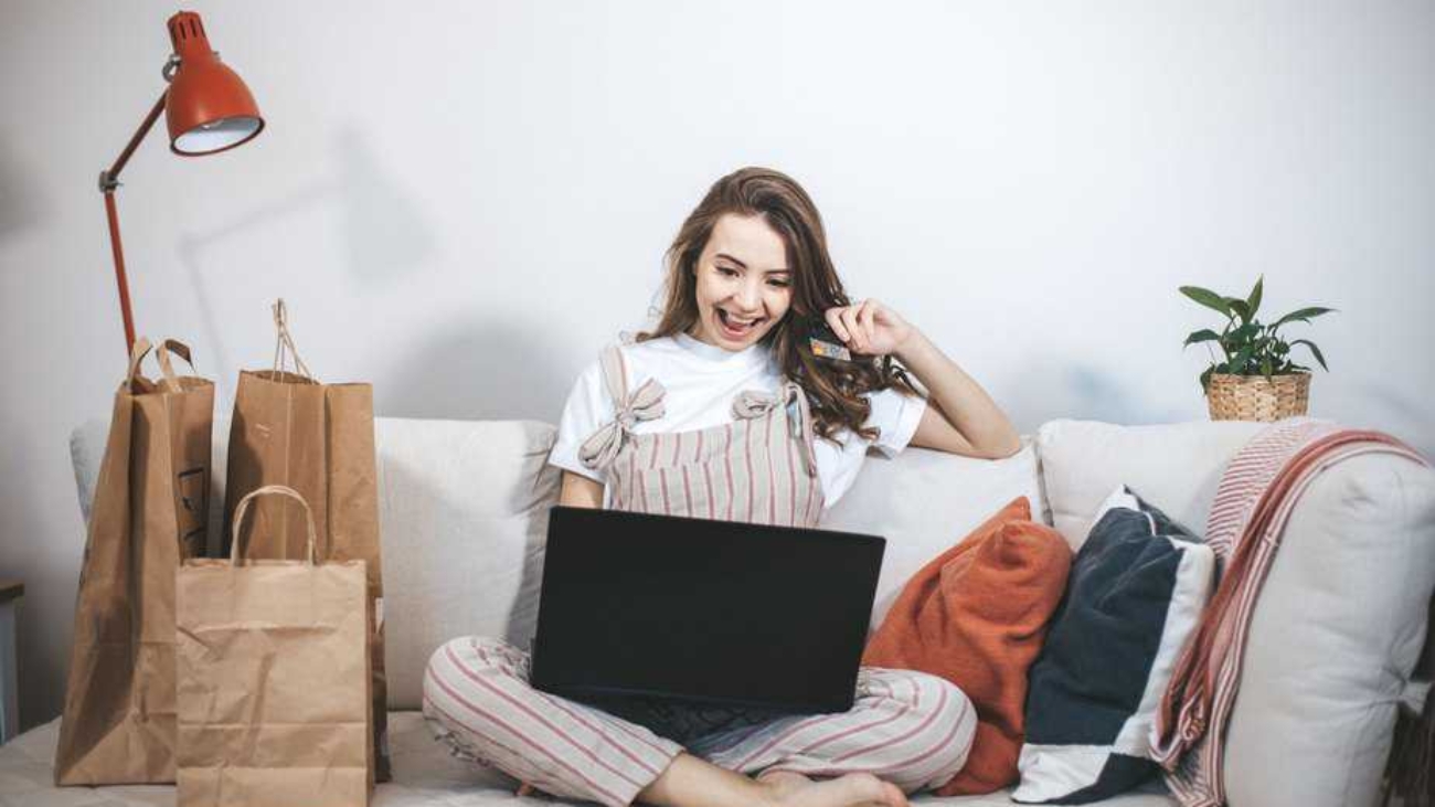 young-millennial-woman-shopping-online-at-home-2021-05-29-18-22-41-utc