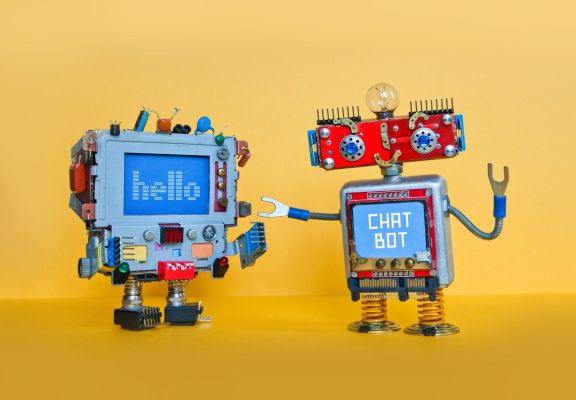 Chat bot robot welcomes android robotic character. Creative design toys on yellow background.