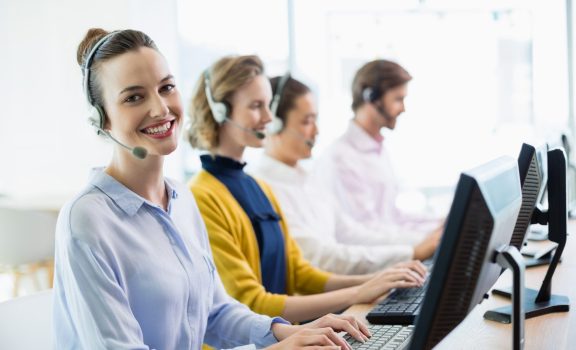 Team of customer service executives working in call center