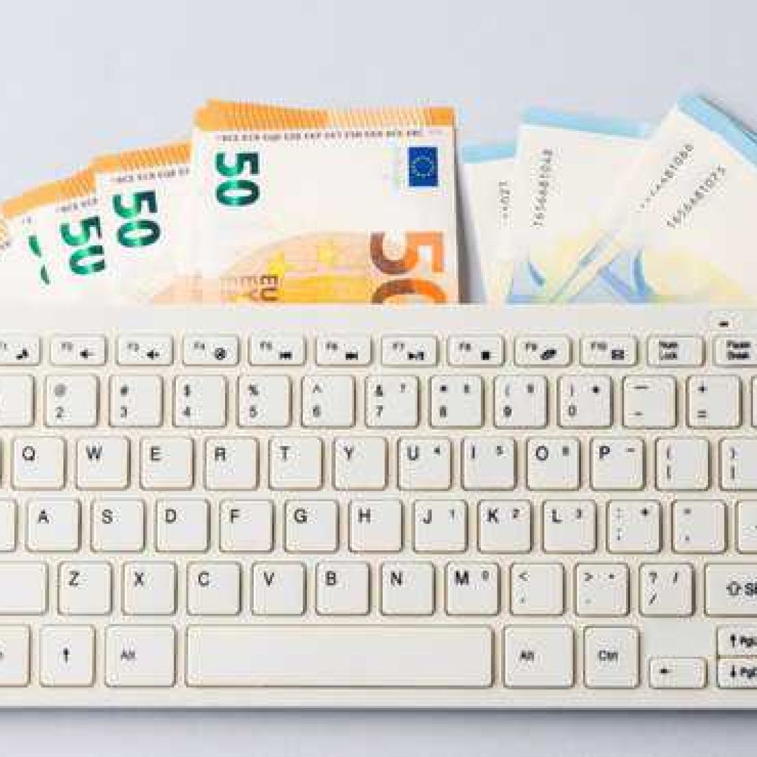 Euro money banknotes under keyboard, online banking, sale of digital info products concept. Financial online investment, trading, income earnings concept, banner