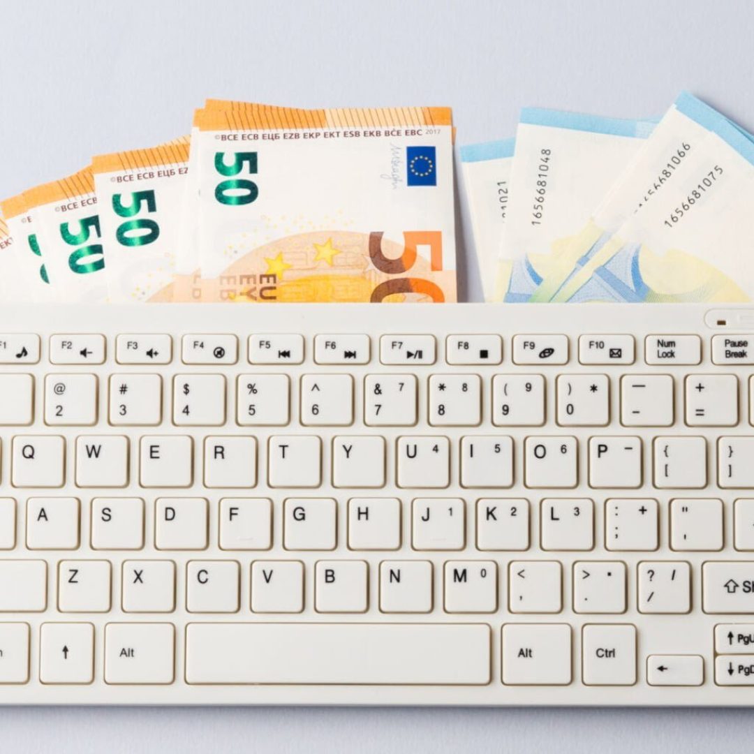 Euro money banknotes under keyboard, online banking, sale of digital info products concept. Financial online investment, trading, income earnings concept, banner